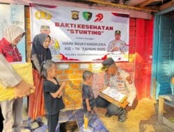 HUT Bhayangkara, Polres OKI Lakukan Penanganan Stunting dan Bagi-bagi Sembako